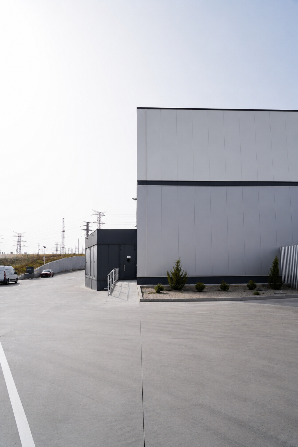 Envelope detail — service yard and exterior composition